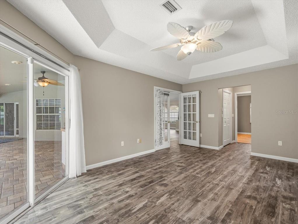 14717 Linden Drive Spring Hill, FL 34609 - Photo 14 of 29 wooden floor in an empty room with a window