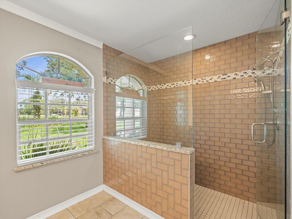 14717 Linden Drive Spring Hill, FL 34609 - Photo 16 of 29 a bathroom with a bathtub and window