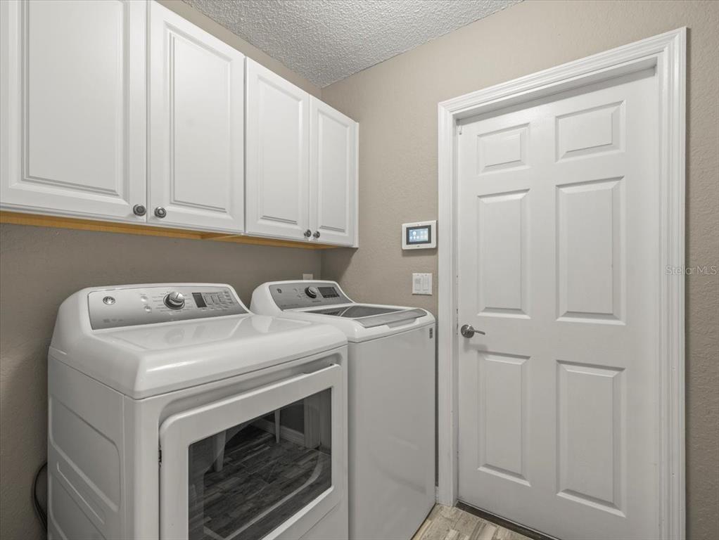14717 Linden Drive Spring Hill, FL 34609 - Photo 23 of 29 a utility room with dryer and washer
