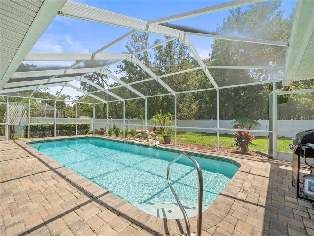 14717 Linden Drive Spring Hill, FL 34609 - Photo 24 of 29 a view of a backyard with swimming pool and sitting area
