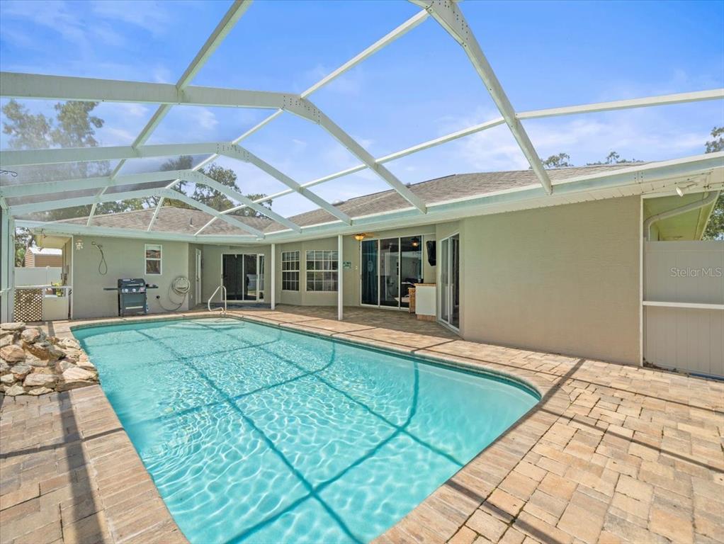 14717 Linden Drive Spring Hill, FL 34609 - Photo 25 of 29 a view of a house with a backyard