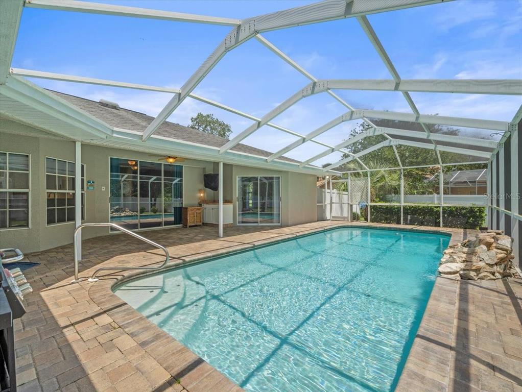 14717 Linden Drive Spring Hill, FL 34609 - Photo 3 of 29 a view of a house with a backyard and a patio