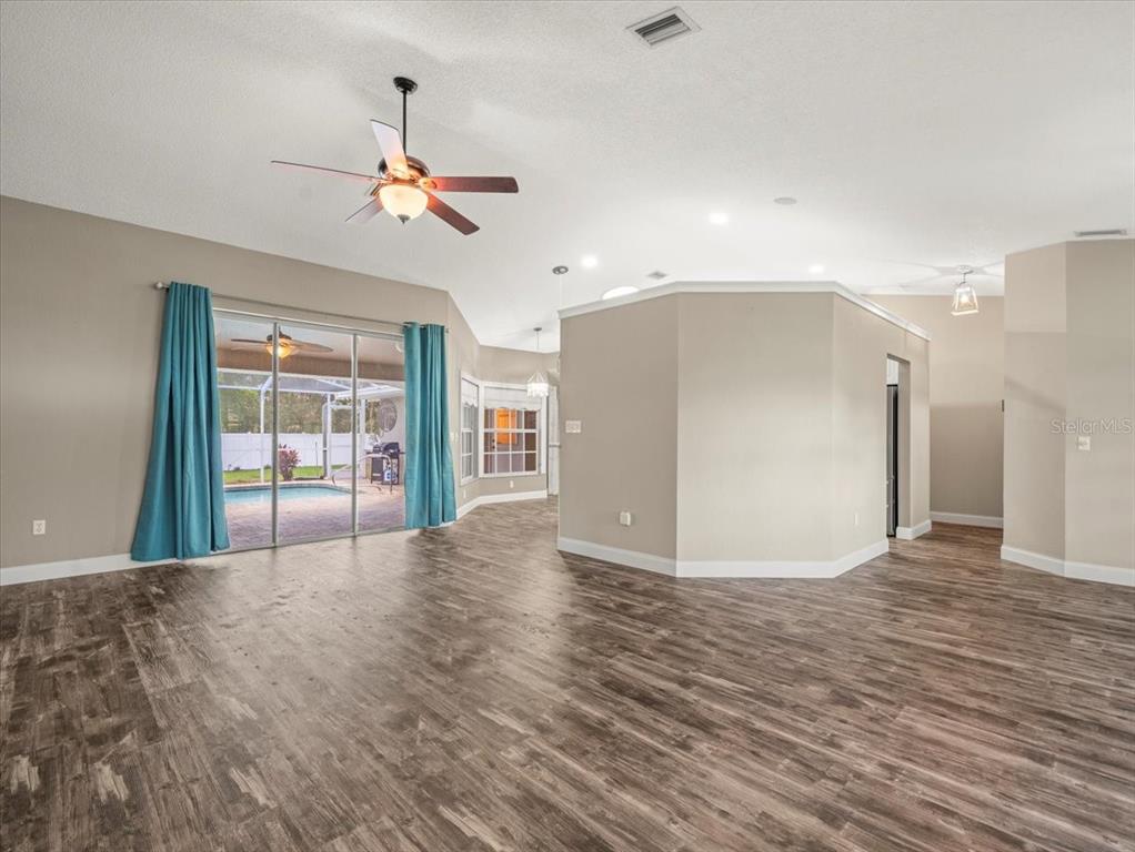 14717 Linden Drive Spring Hill, FL 34609 - Photo 4 of 29 a view of a livingroom with a ceiling fan and window