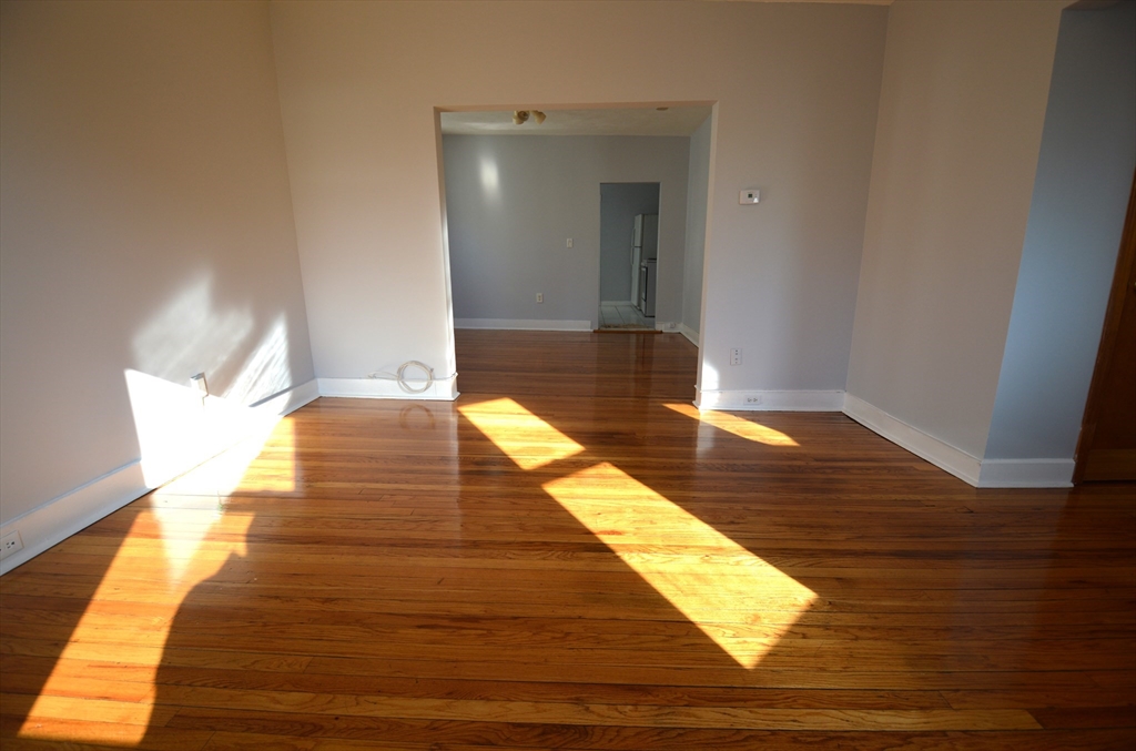 32 Stellman Road, Unit 2 Boston, MA 02131 - Photo 5 of 16 a view of wooden floor and a bathroom