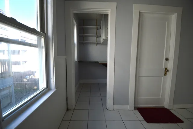 a view of a closet area with living room
