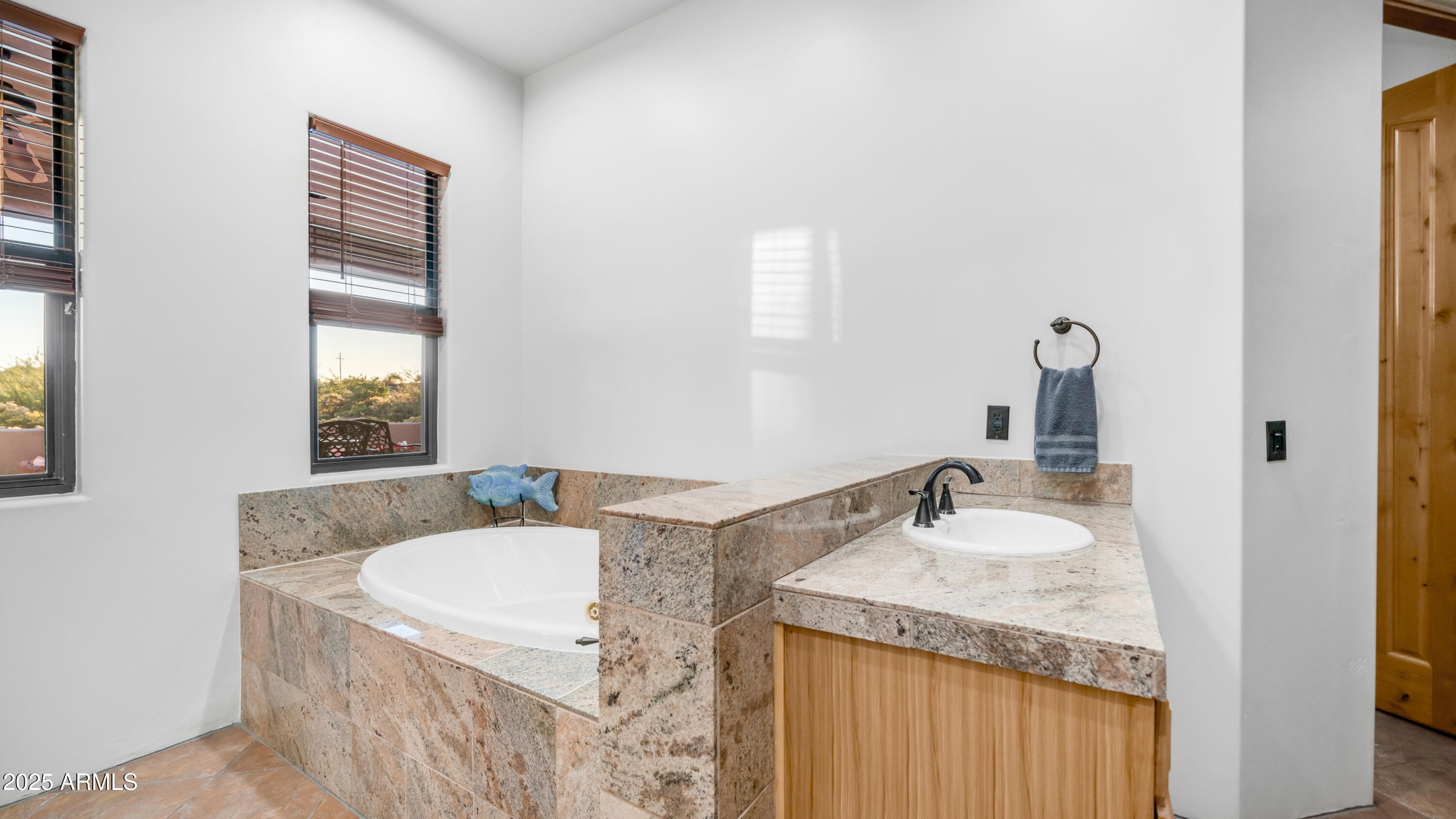 42215 North La Plata Road Scottsdale, AZ 85262 - Photo 27 of 93 a bathroom with a granite countertop sink and a mirror