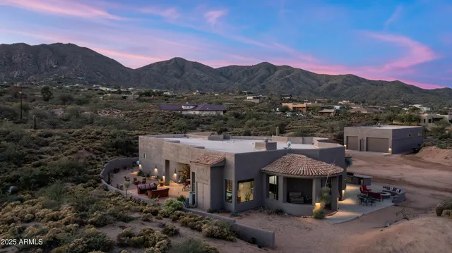 a kitchen with stainless steel appliances granite countertop a refrigerator a sink and a stove