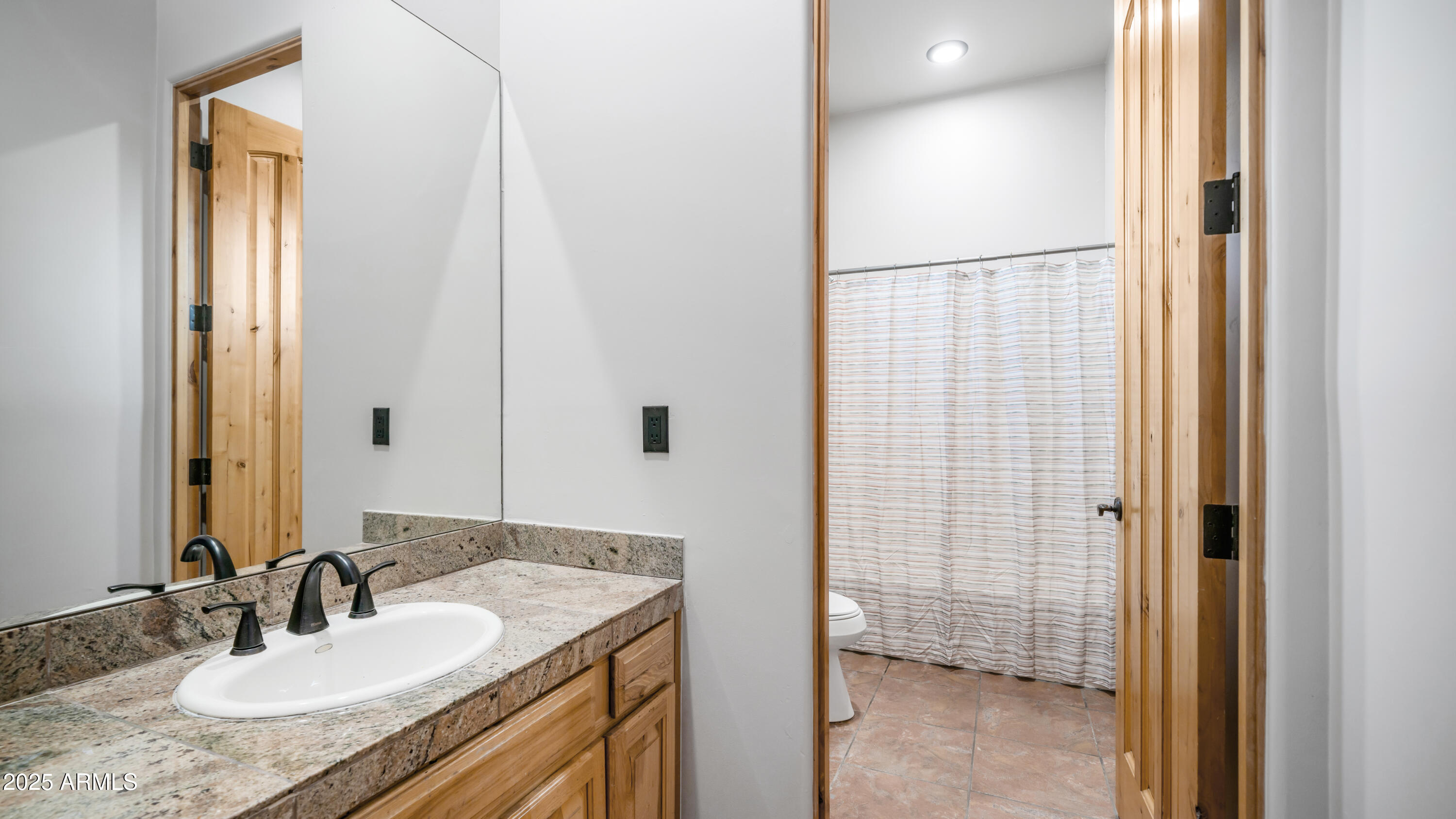 42215 North La Plata Road Scottsdale, AZ 85262 - Photo 36 of 93 a bathroom with a granite countertop sink and a mirror