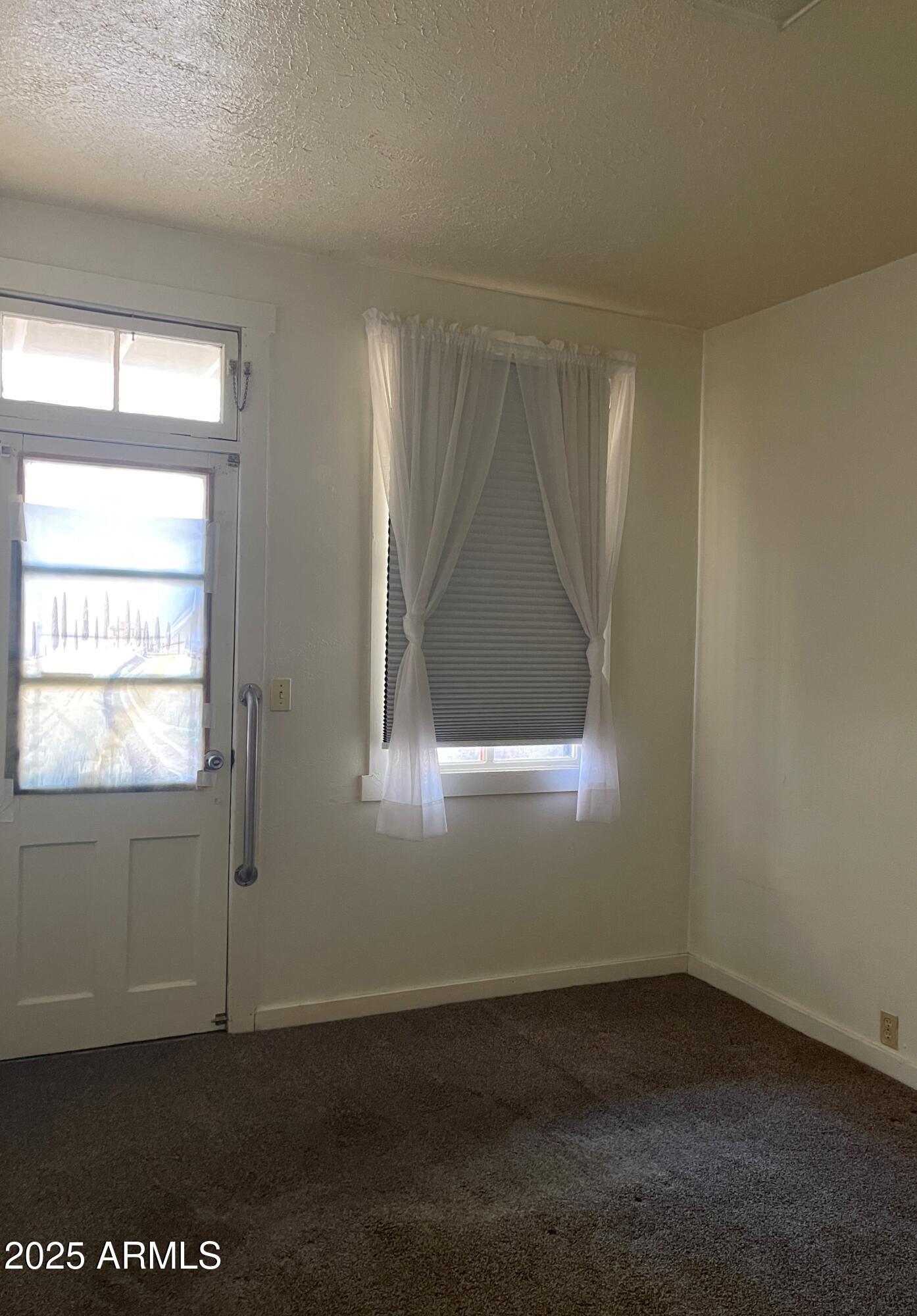 102 Opera Drive, Unit B Bisbee, AZ 85603 - Photo 4 of 8 Small bedroom 1