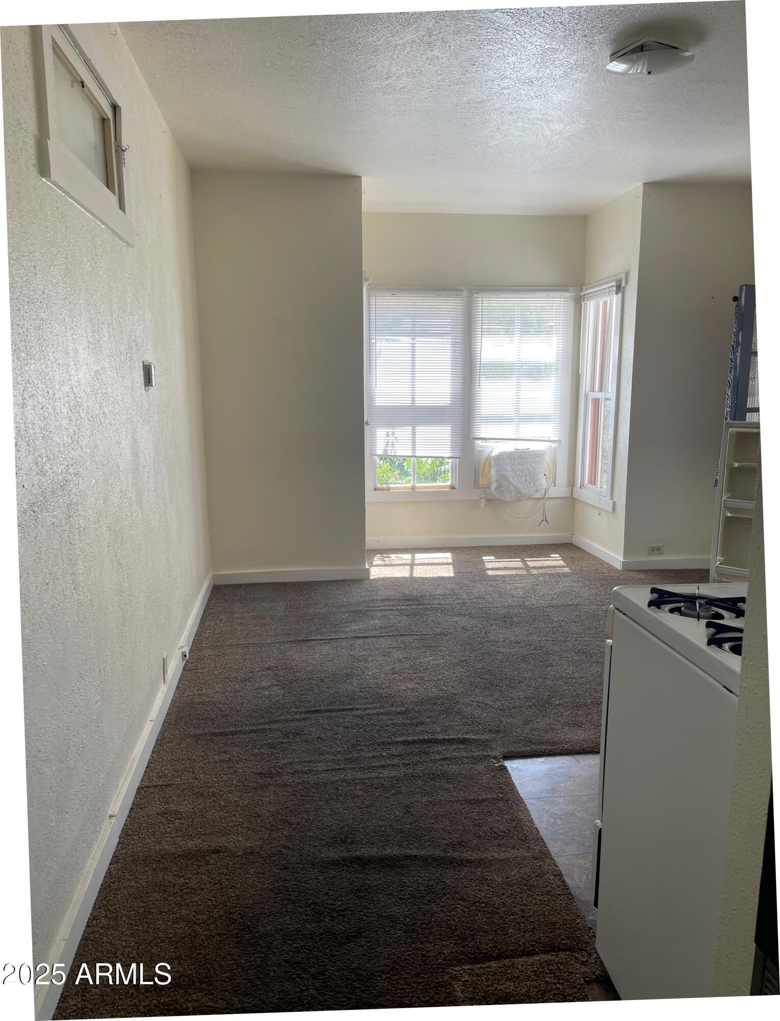 102 Opera Drive, Unit B Bisbee, AZ 85603 - Photo 6 of 8 From hallway to livingroom and nook