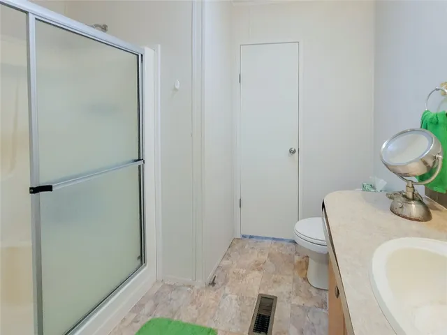 a bathroom with a sink and toilet