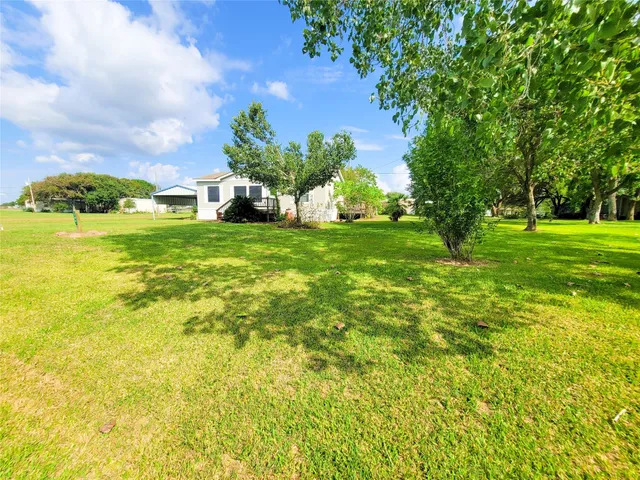 a view of a garden with houses