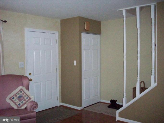 1079 Downton Road Halethorpe, MD 21227 - Photo 2 of 26 a view of bedroom with furniture and wooden floor