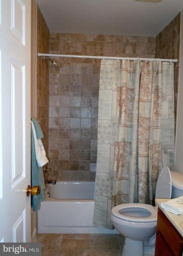 1079 Downton Road Halethorpe, MD 21227 - Photo 11 of 26 a bathroom with a shower and a toilet