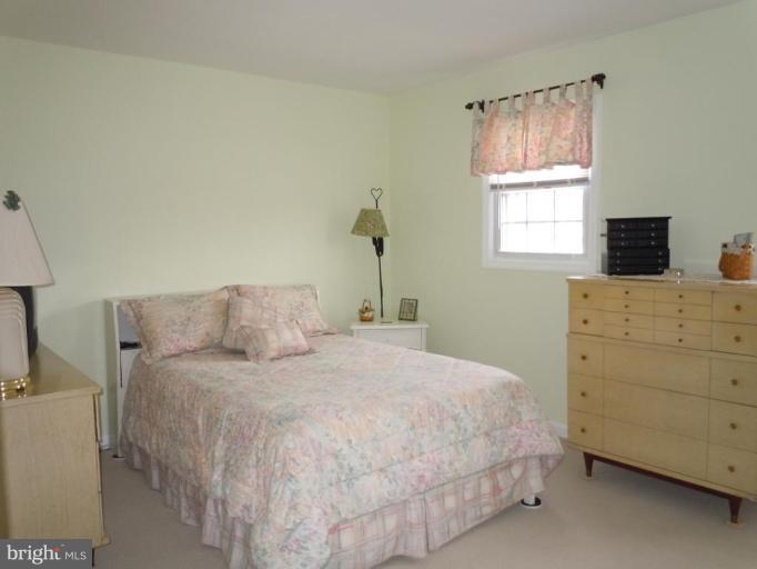 1079 Downton Road Halethorpe, MD 21227 - Photo 12 of 26 a bedroom with a bed and a window
