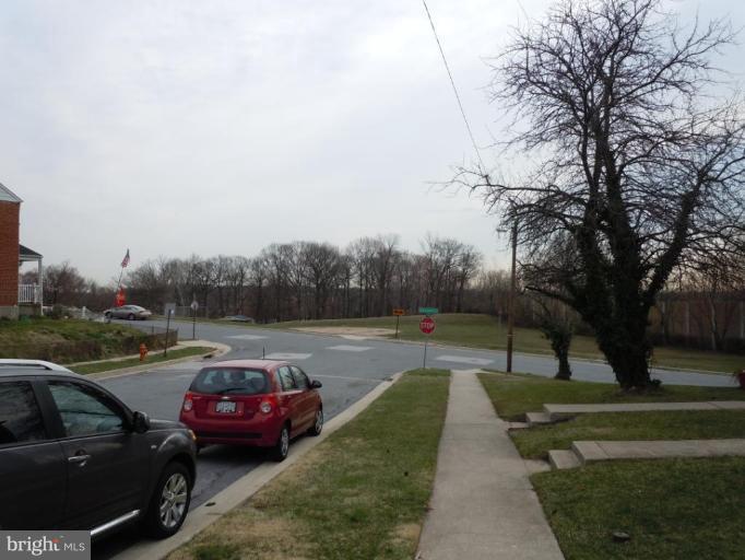 1079 Downton Road Halethorpe, MD 21227 - Photo 24 of 26 a view of street with parked cars