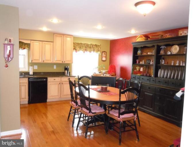 1079 Downton Road Halethorpe, MD 21227 - Photo 4 of 26 a dining room with furniture and wooden floor