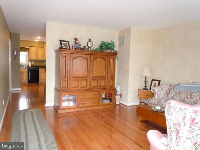 1079 Downton Road Halethorpe, MD 21227 - Photo 5 of 26 a living room with furniture and wooden floor