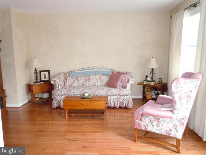 1079 Downton Road Halethorpe, MD 21227 - Photo 7 of 26 a living room with furniture and a table