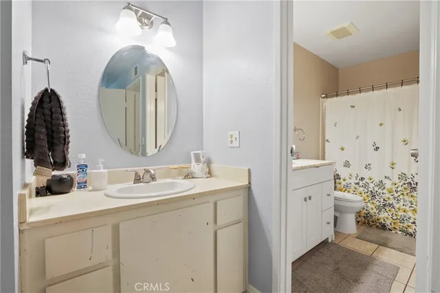a view of a bathroom from a hallway