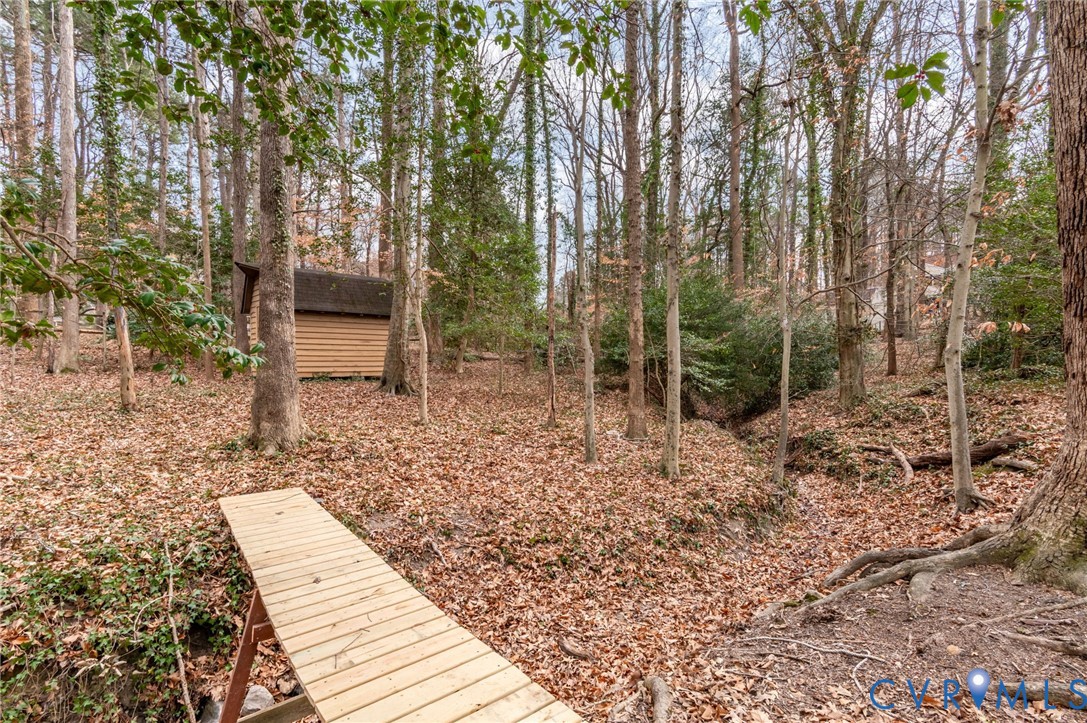 3123 Bradwill Road Richmond, VA 23225 - Photo 11 of 36 View of yard featuring a storage unit