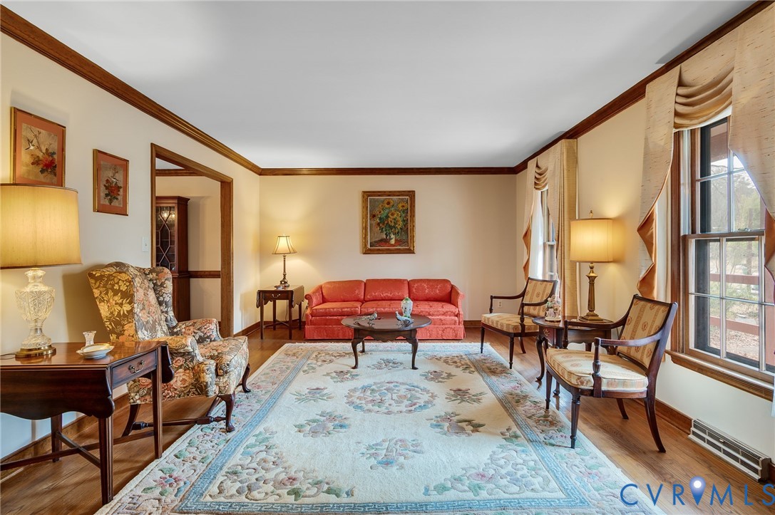 3123 Bradwill Road Richmond, VA 23225 - Photo 13 of 36 Living area featuring ornamental molding and wood