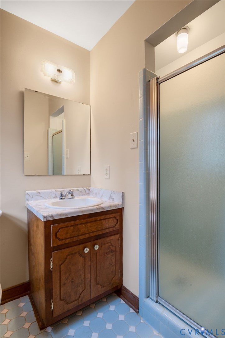 3123 Bradwill Road Richmond, VA 23225 - Photo 25 of 36 Bathroom with a shower stall, vanity, and light fl