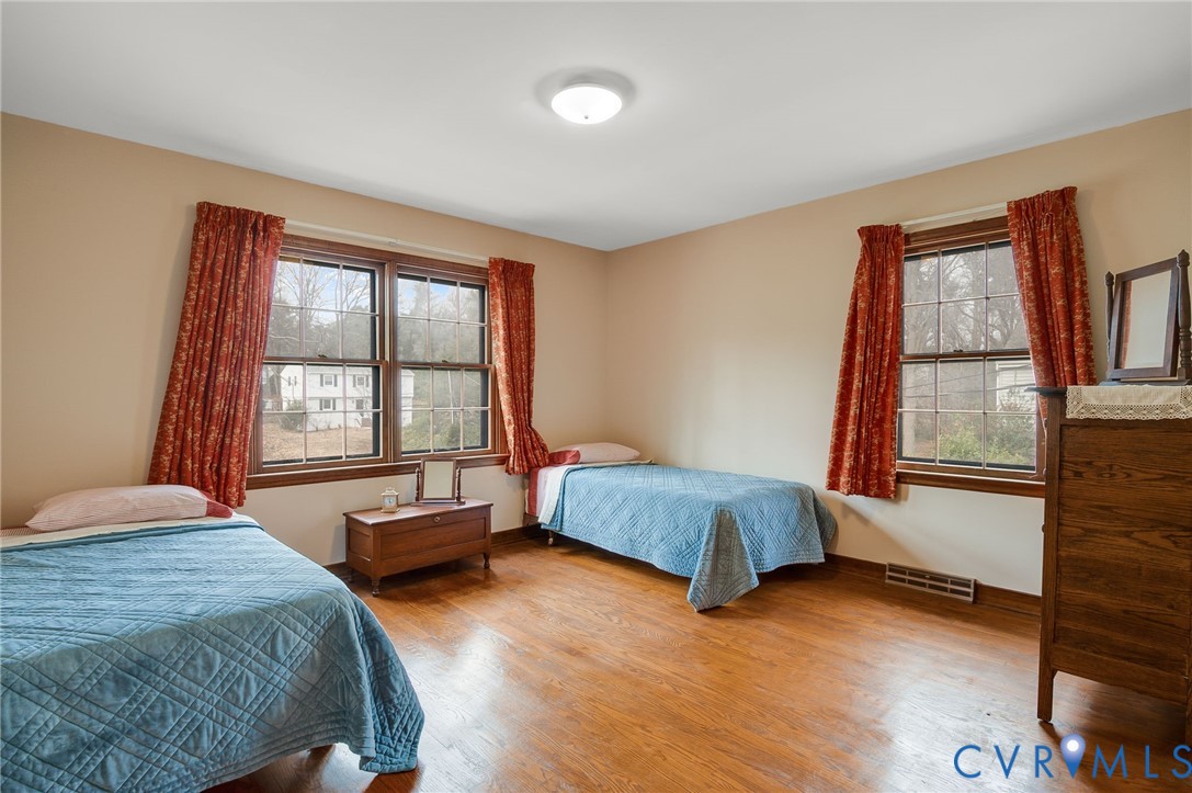 3123 Bradwill Road Richmond, VA 23225 - Photo 26 of 36 Bedroom with multiple windows and wood finished fl