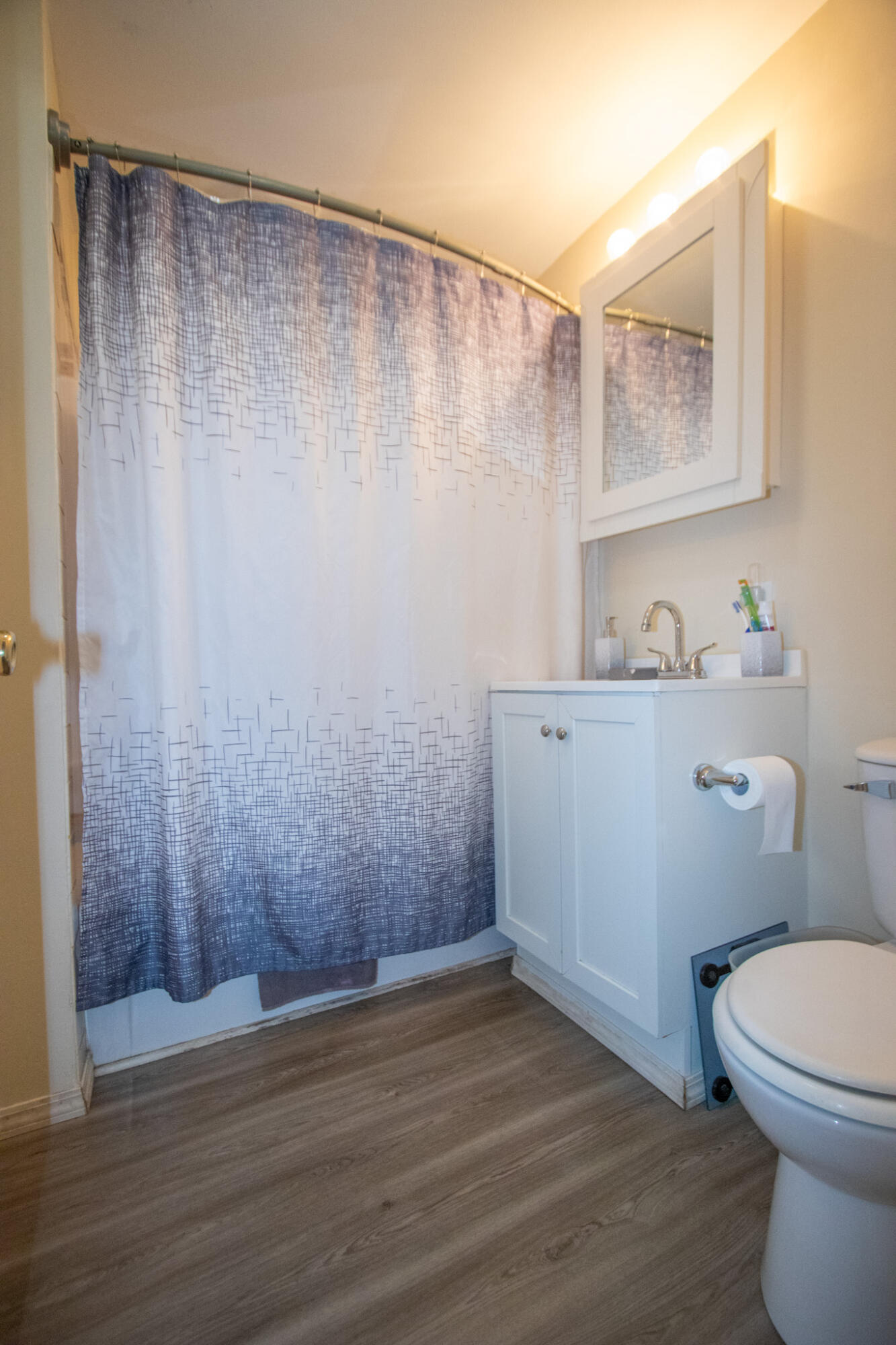 2401 Riverside Drive Lake Station, IN 46405 - Photo 13 of 28 a bathroom with a sink a toilet and shower