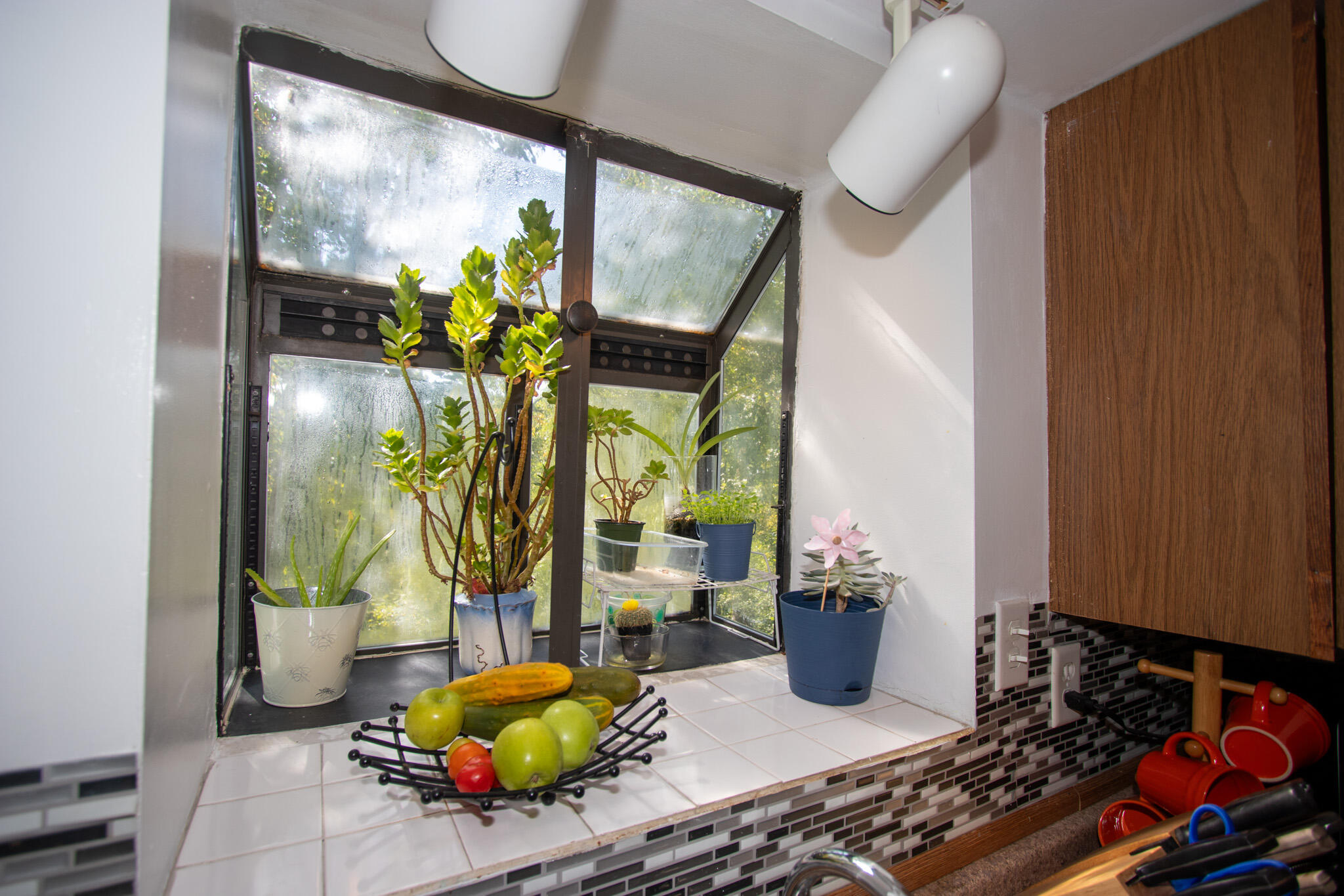 2401 Riverside Drive Lake Station, IN 46405 - Photo 15 of 28 a living room with furniture flowers and floor to ceiling window