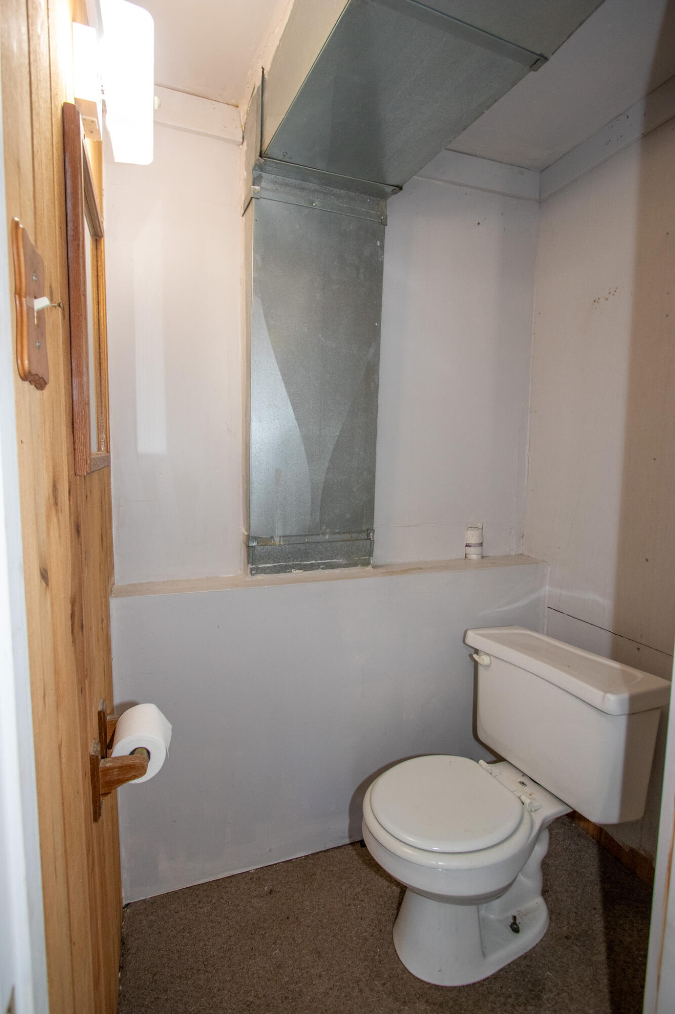 2401 Riverside Drive Lake Station, IN 46405 - Photo 19 of 28 a bathroom with a toilet and a mirror