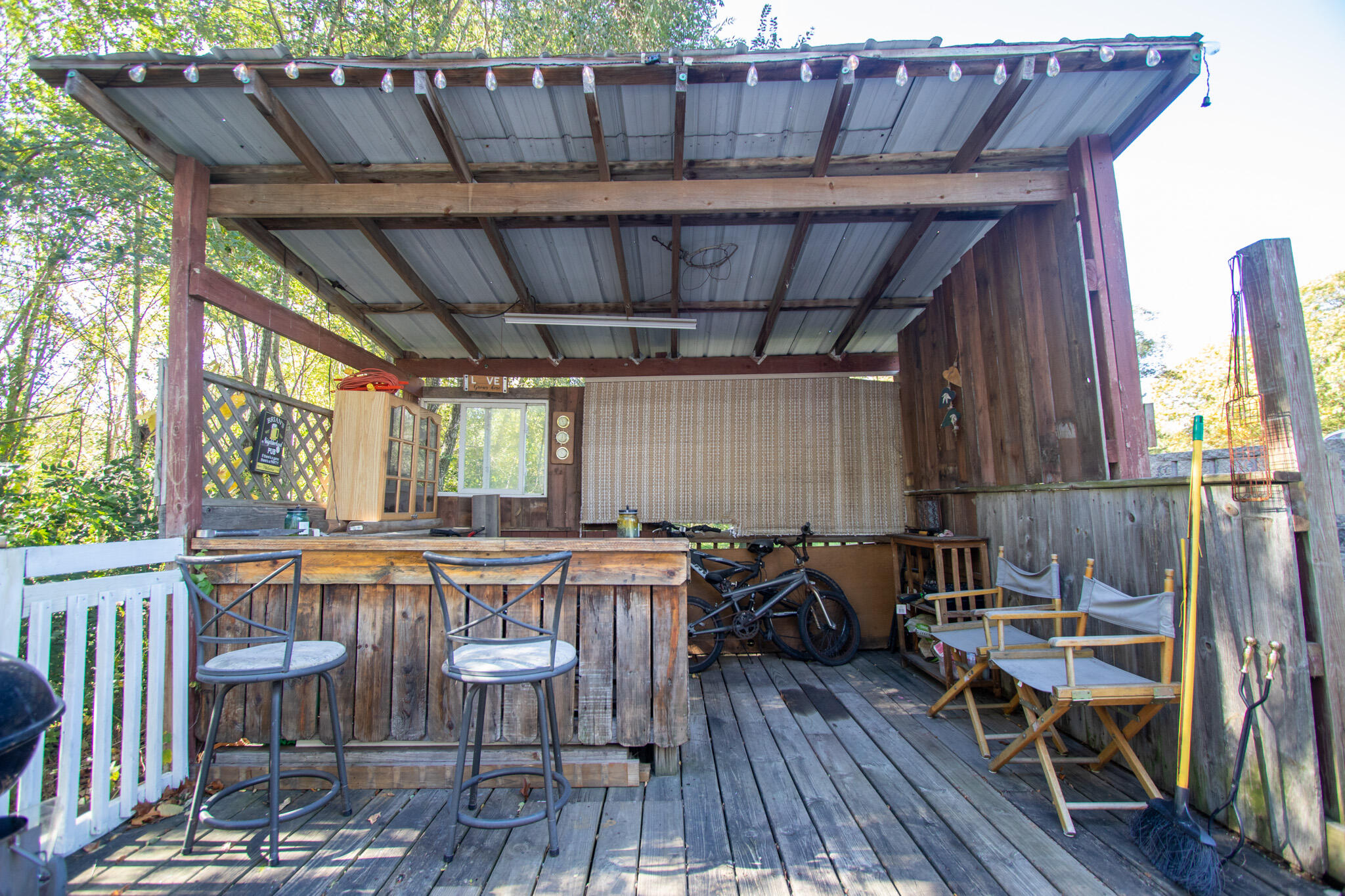 2401 Riverside Drive Lake Station, IN 46405 - Photo 25 of 28 a view of a patio with table and chairs a barbeque with wooden floor