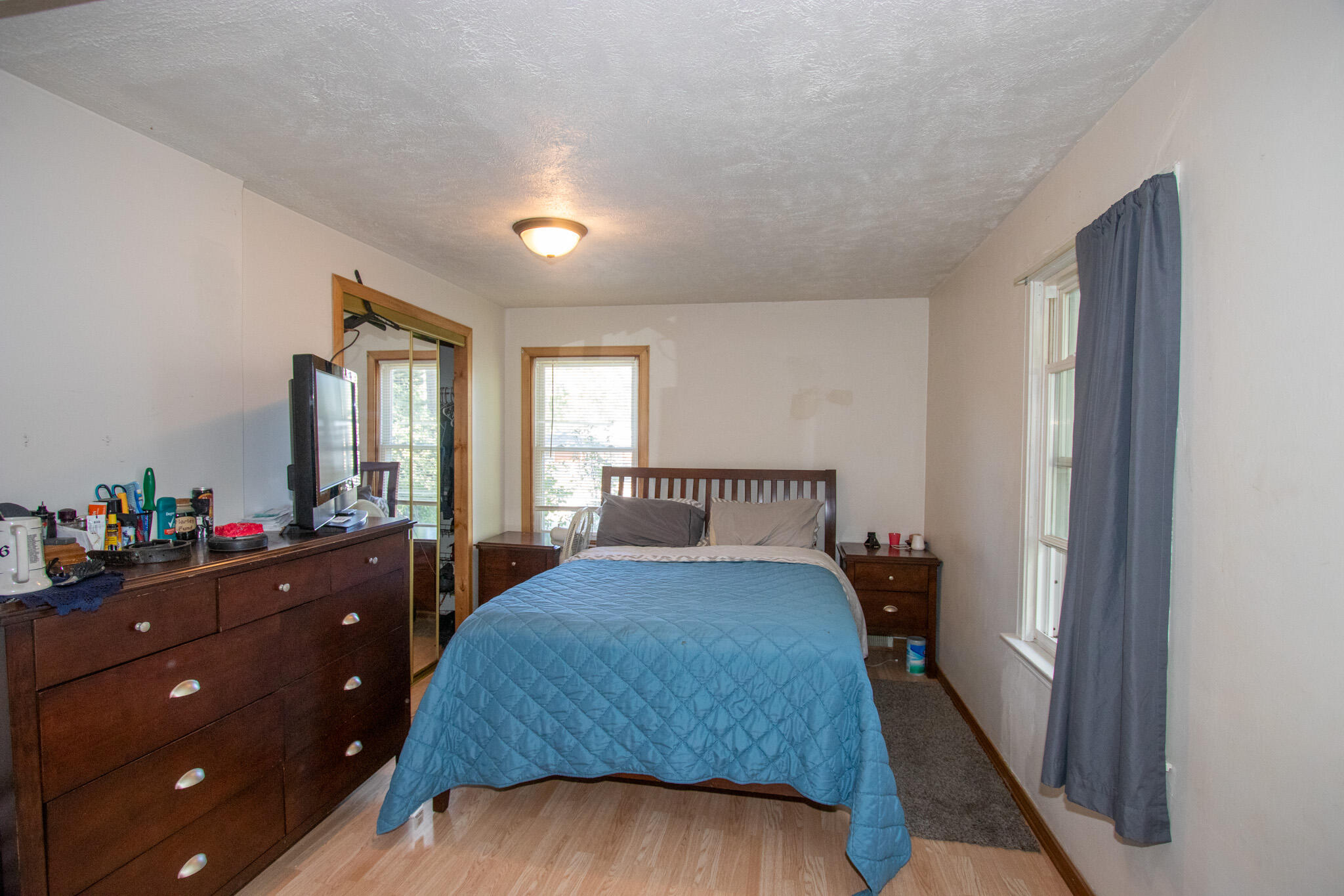 2401 Riverside Drive Lake Station, IN 46405 - Photo 9 of 28 a bedroom with a bed and a dresser