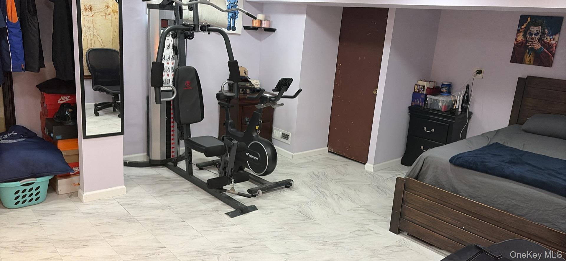 153-12 111th Road Queens, NY 11433 - Photo 11 of 15 a view of a room with gym equipment