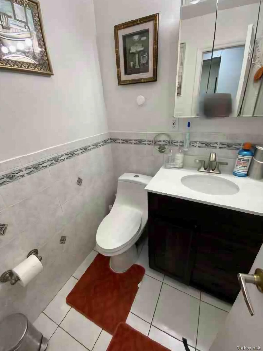 153-12 111th Road Queens, NY 11433 - Photo 4 of 15 a bathroom with a sink toilet and shower