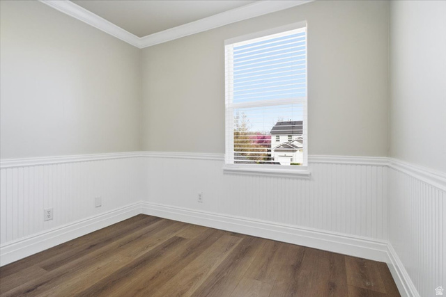 4496 West 11800 South South Jordan, UT 84009 - Photo 26 of 33 Empty room with ornamental molding, dark wood finished floors, and a wainscoted wall