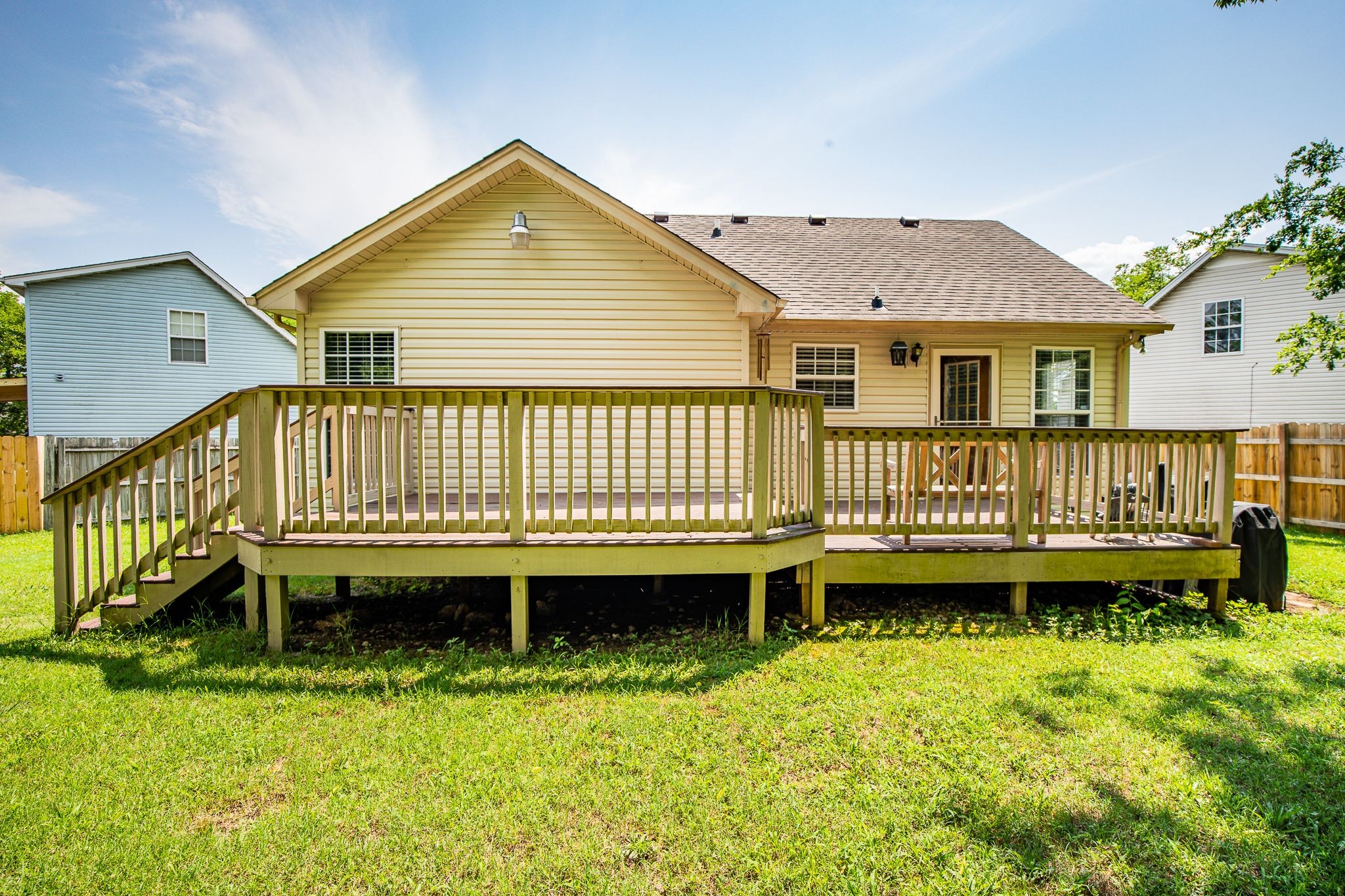 121 Rothwood Court Madison, TN 37115 - Photo 17 of 21 a view of a house with a wooden deck and a yard
