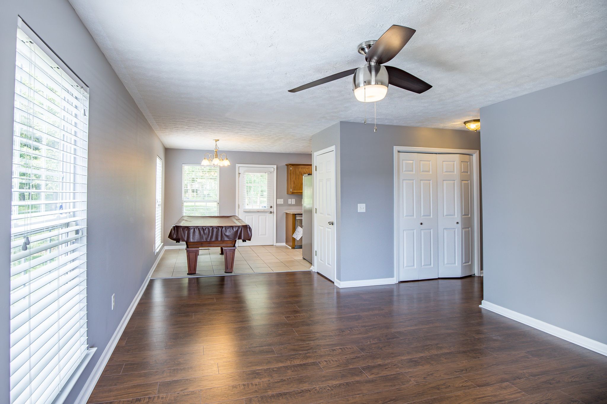 121 Rothwood Court Madison, TN 37115 - Photo 5 of 21 a view of an empty room with window and wooden floor