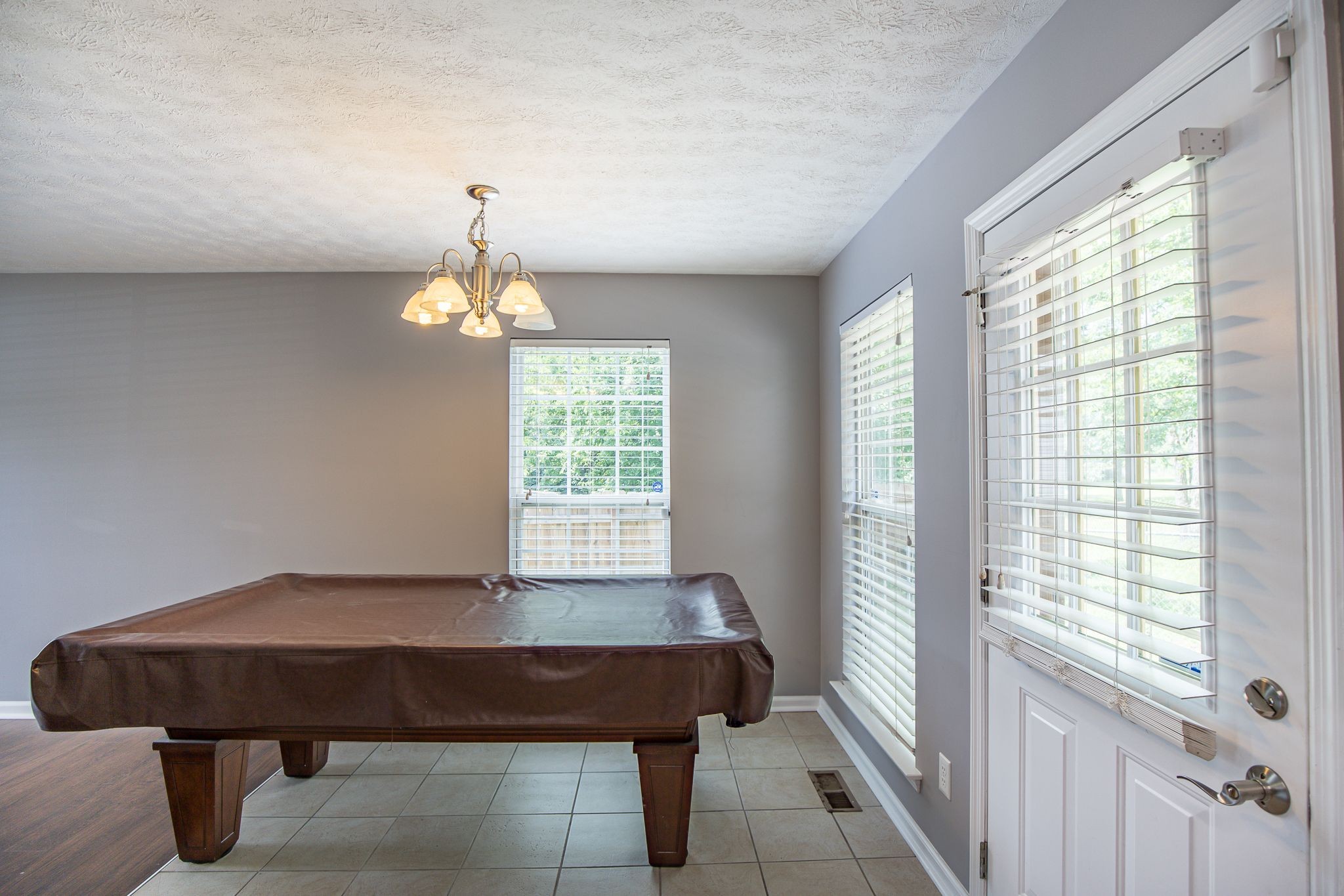 121 Rothwood Court Madison, TN 37115 - Photo 6 of 21 a room with a table window and chandelier