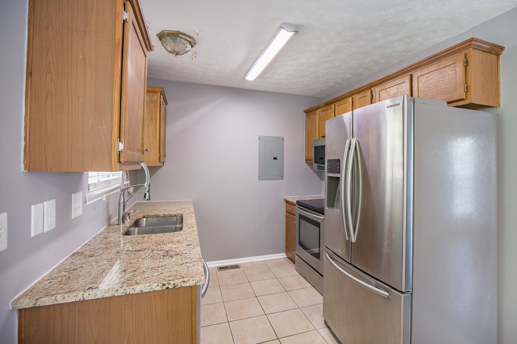 121 Rothwood Court Madison, TN 37115 - Photo 8 of 21 a kitchen with stainless steel appliances granite countertop a refrigerator and a sink