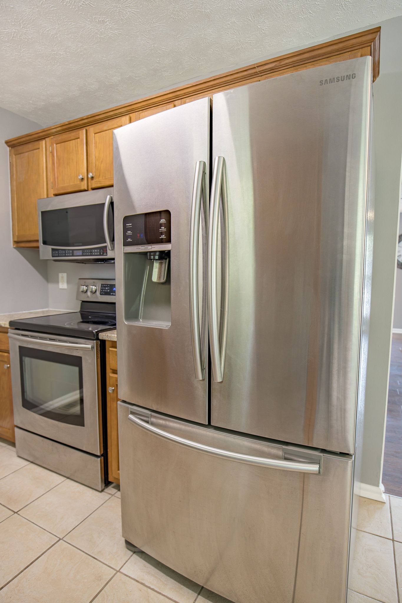 121 Rothwood Court Madison, TN 37115 - Photo 9 of 21 a metallic refrigerator freezer sitting in a kitchen