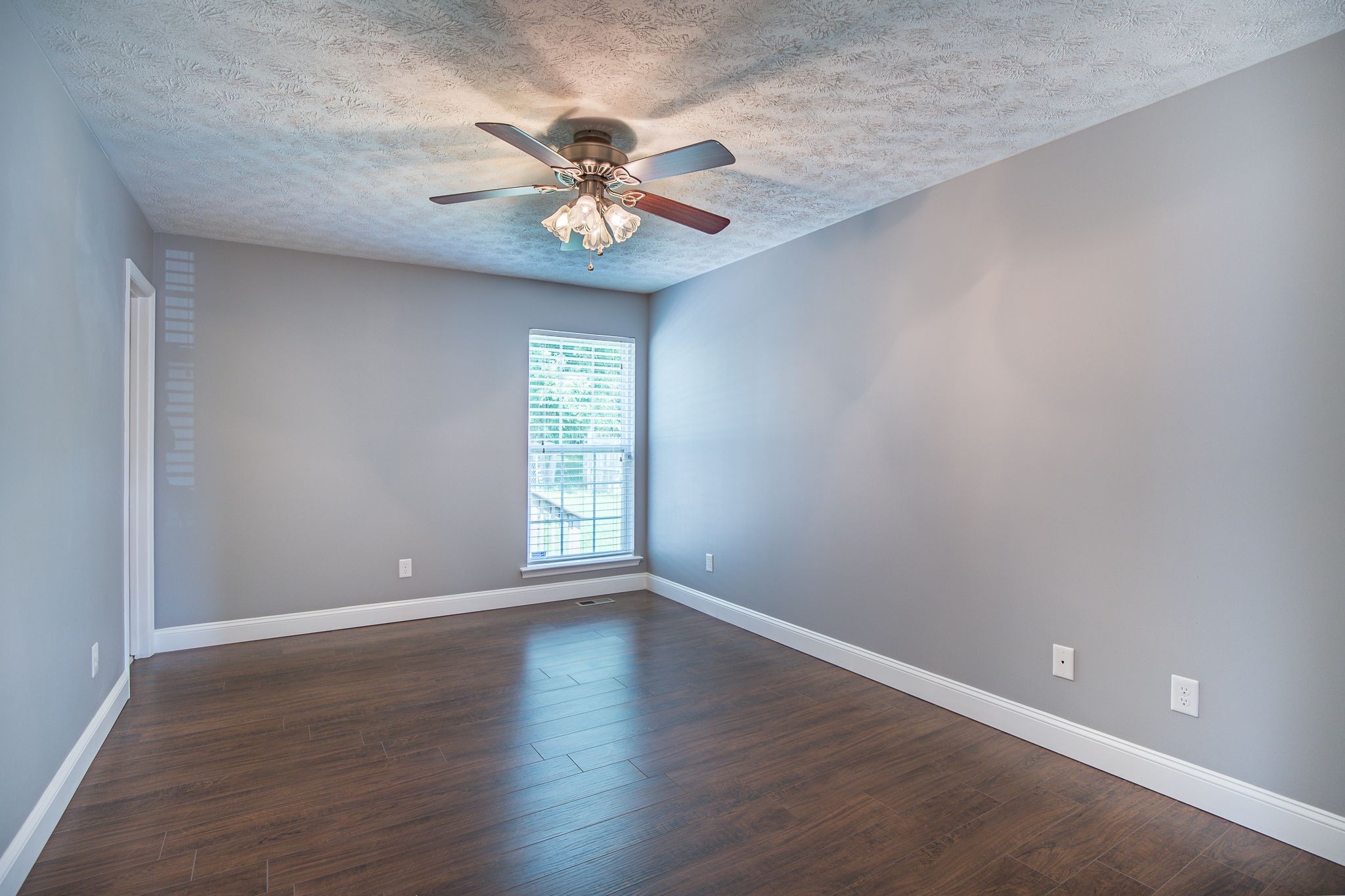 121 Rothwood Court Madison, TN 37115 - Photo 10 of 21 a view of an empty room with a window and wooden floor