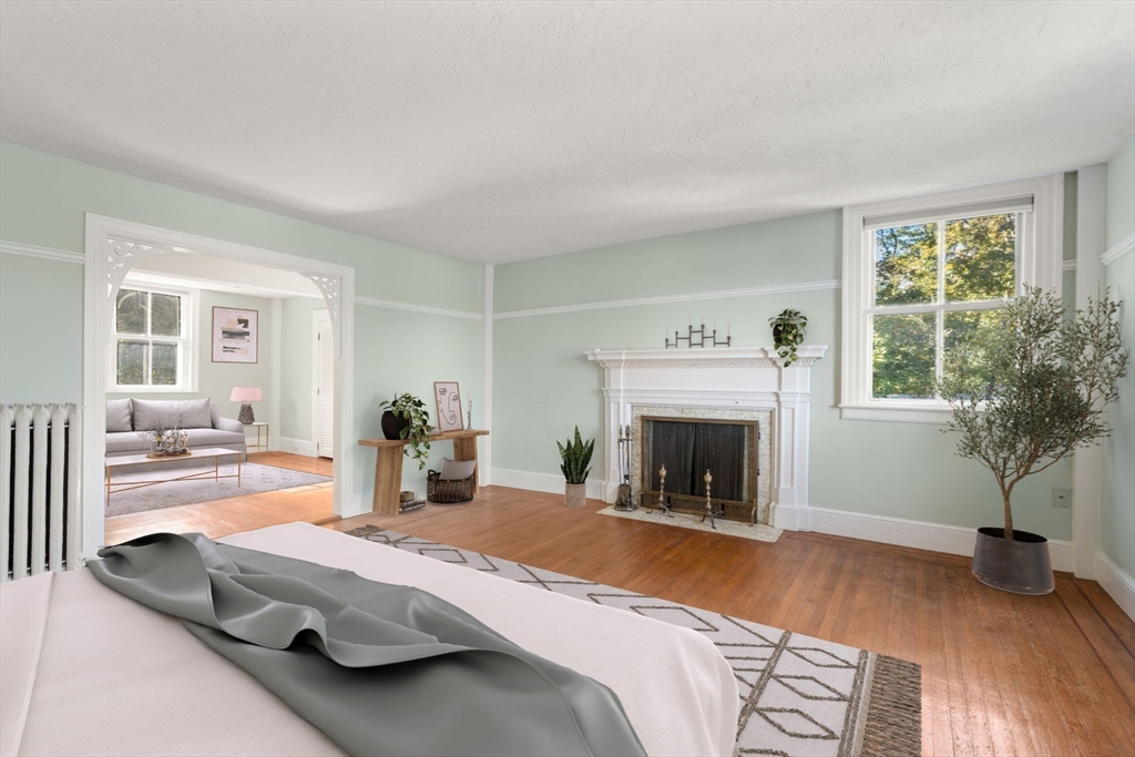 324 Union Street, Unit 1 Millis, MA 02054 - Photo 12 of 29 a bedroom with a bed and a fireplace