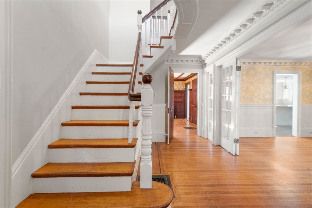 324 Union Street, Unit 1 Millis, MA 02054 - Photo 2 of 29 a view of entryway and hall with wooden floor