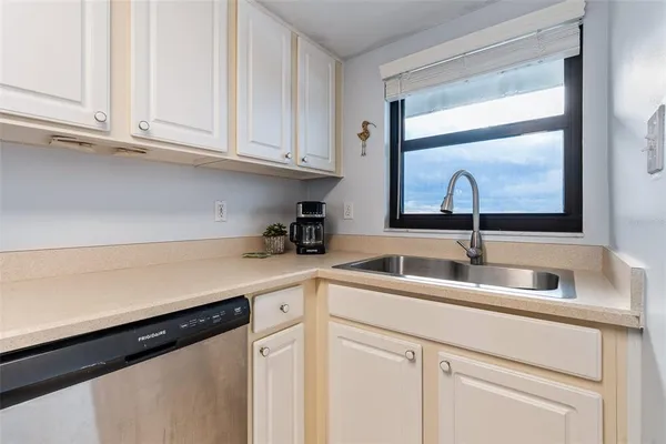 a kitchen with a sink and cabinets