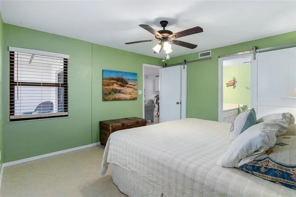 a bedroom with a bed and window