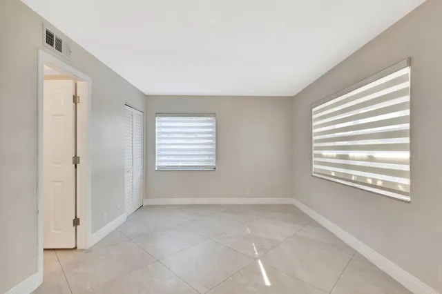 a bathroom with a shower a sink and a mirror