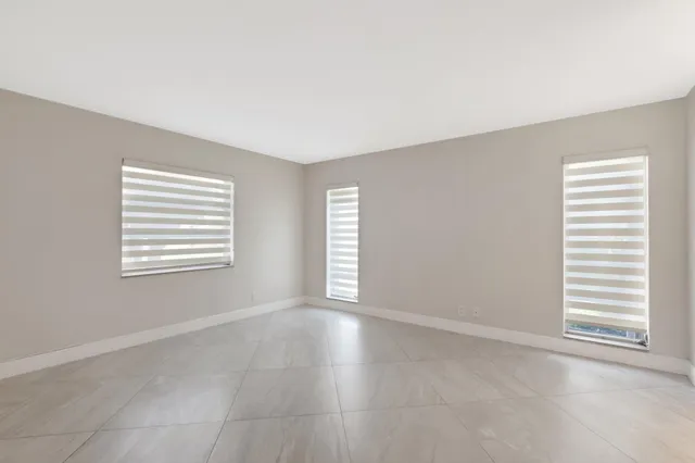 a bathroom with double sink and a mirror