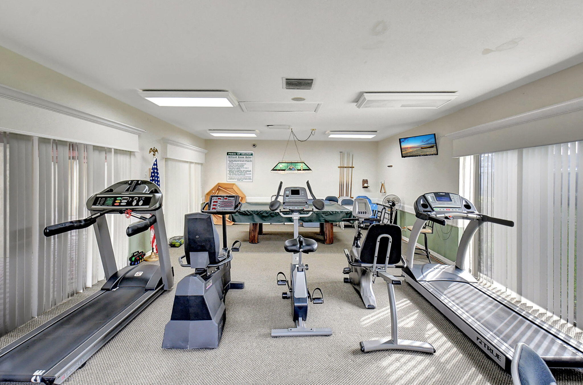 1131 Violet Terrace, Unit 104 Delray Beach, FL 33445 - Photo 30 of 36 a view of a room with gym equipment