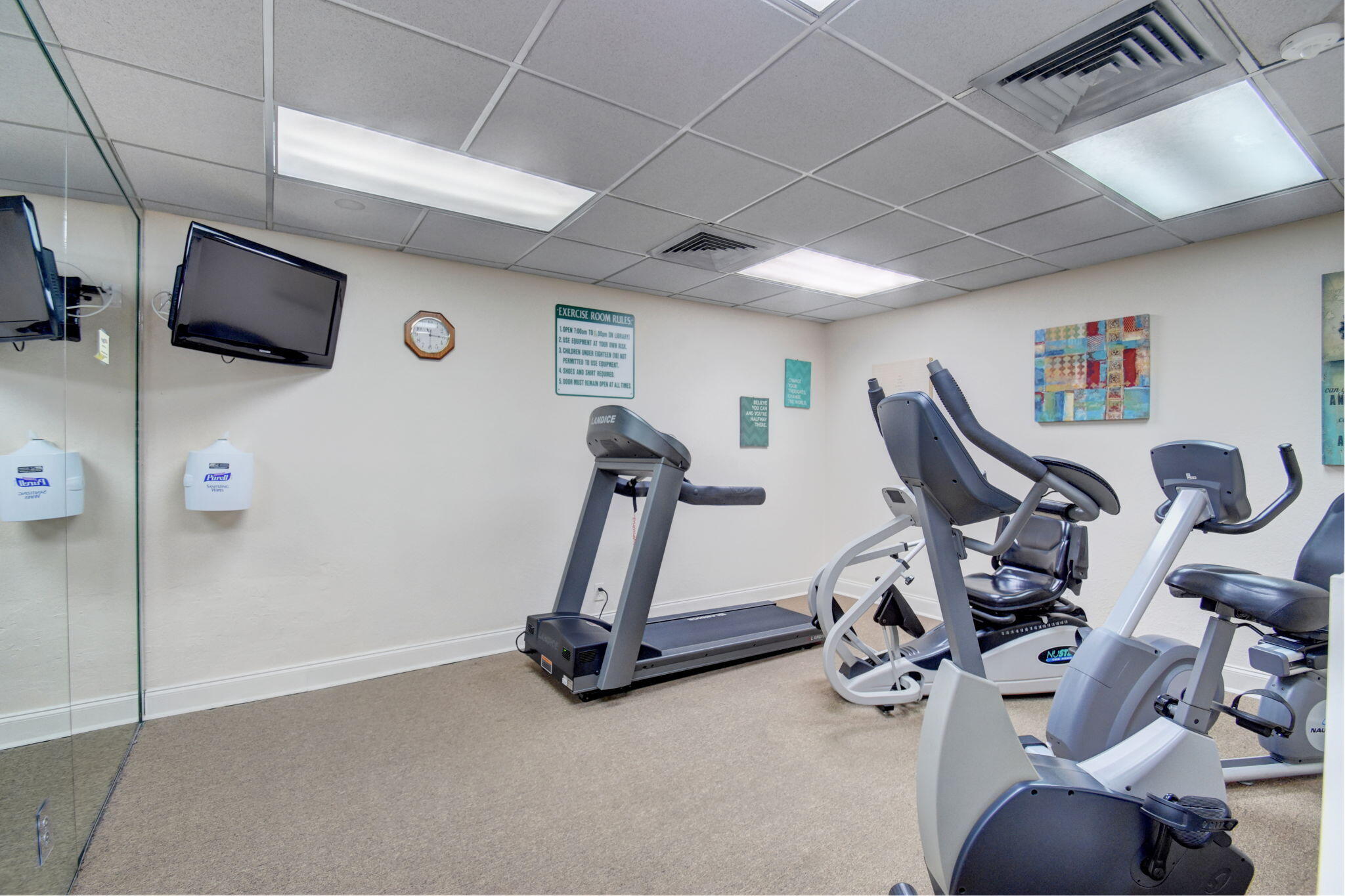 1131 Violet Terrace, Unit 104 Delray Beach, FL 33445 - Photo 35 of 36 a view of a room with gym equipment